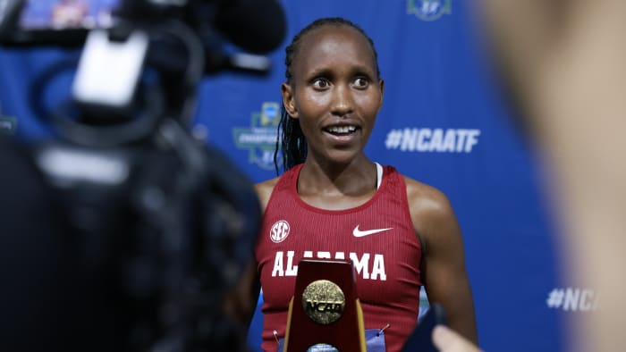 Mercy Chelangat with national championship trophy